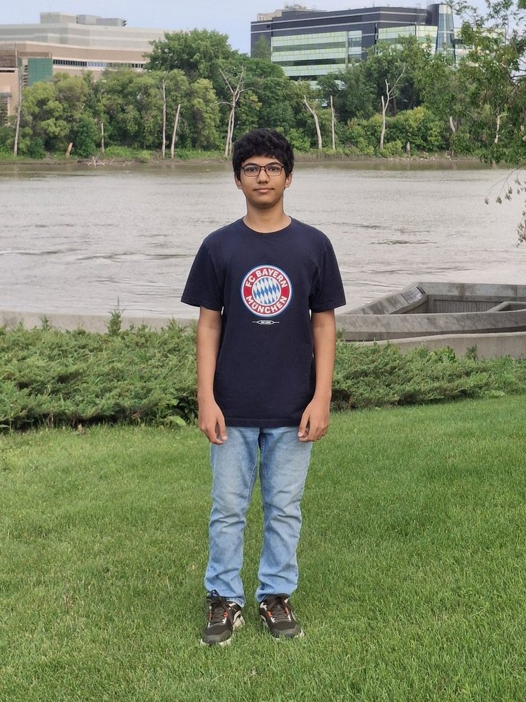 Shayan Suvro Saha standing by a river